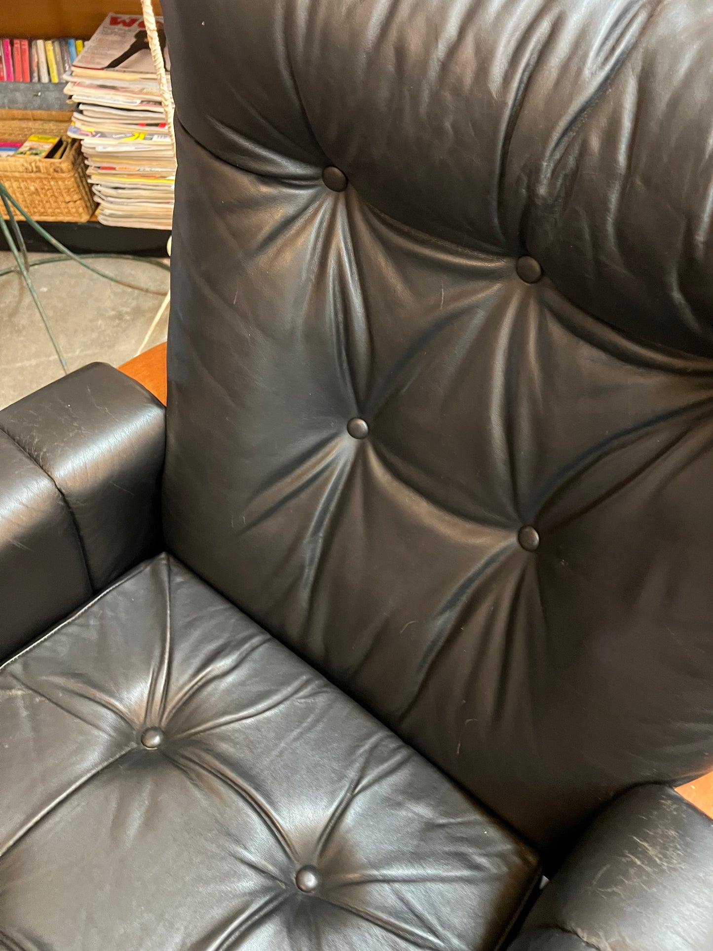 2. Mid-Century Black Leather Swivel Lounge Chair