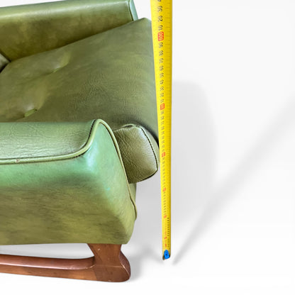 Olive Green Vinyl Lounge Armchair with Timber Sleigh Base
 (rip on side)