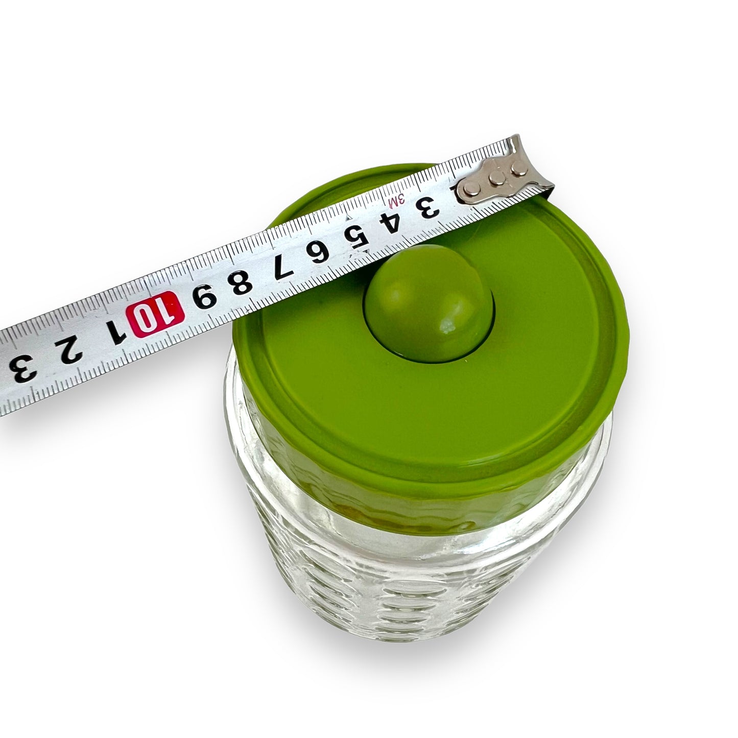 Green lid circle clear glass pattern jar