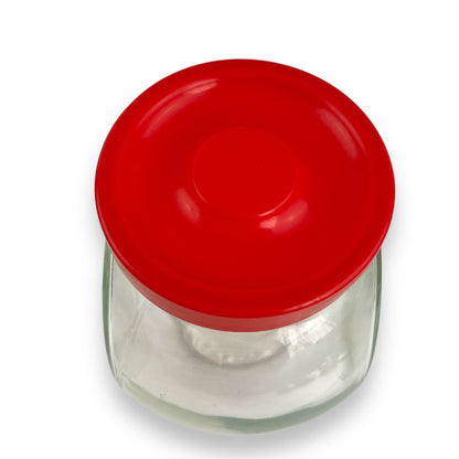 Red lid round glass storage jar