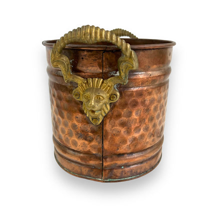 Brass and copper lion head plant pot
