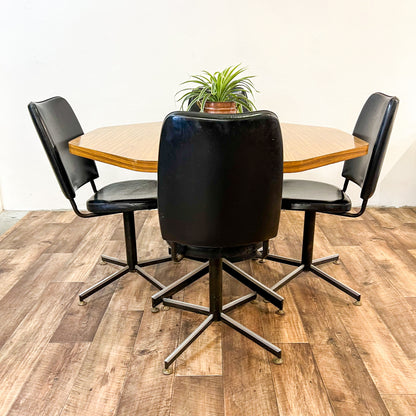 Brown Laminate Octagon Dining Table and 4 Black swivel dining chairs