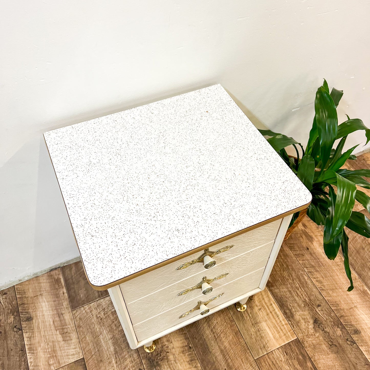 White & gold bedside table