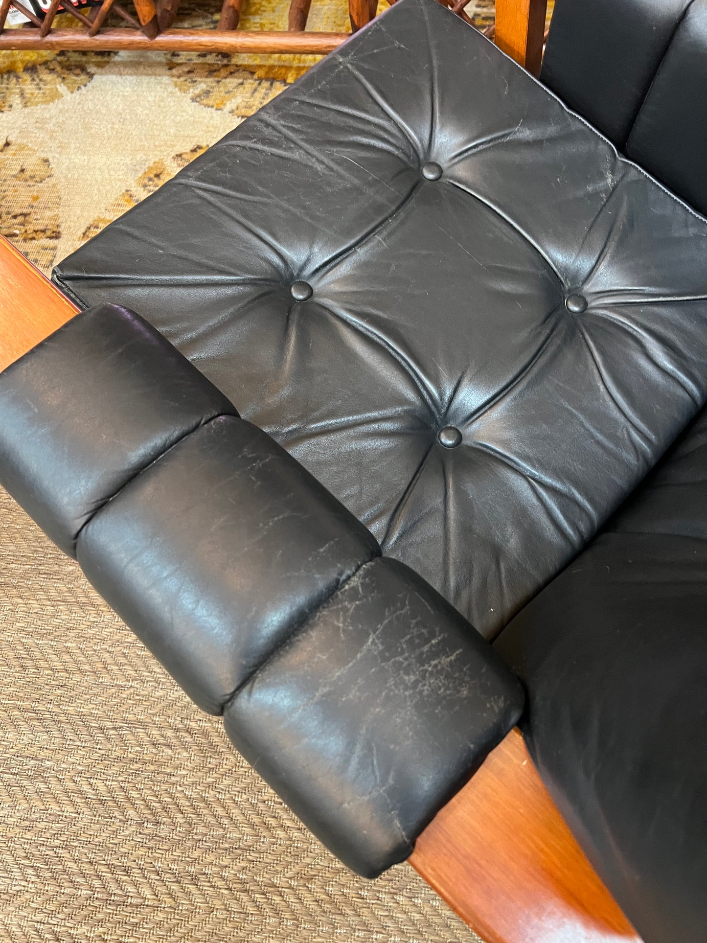 2. Mid-Century Black Leather Swivel Lounge Chair