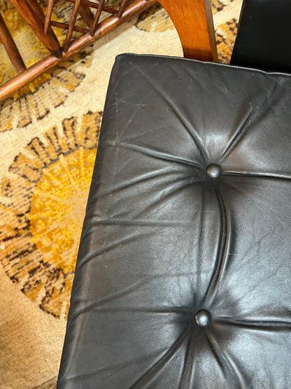 2. Mid-Century Black Leather Swivel Lounge Chair