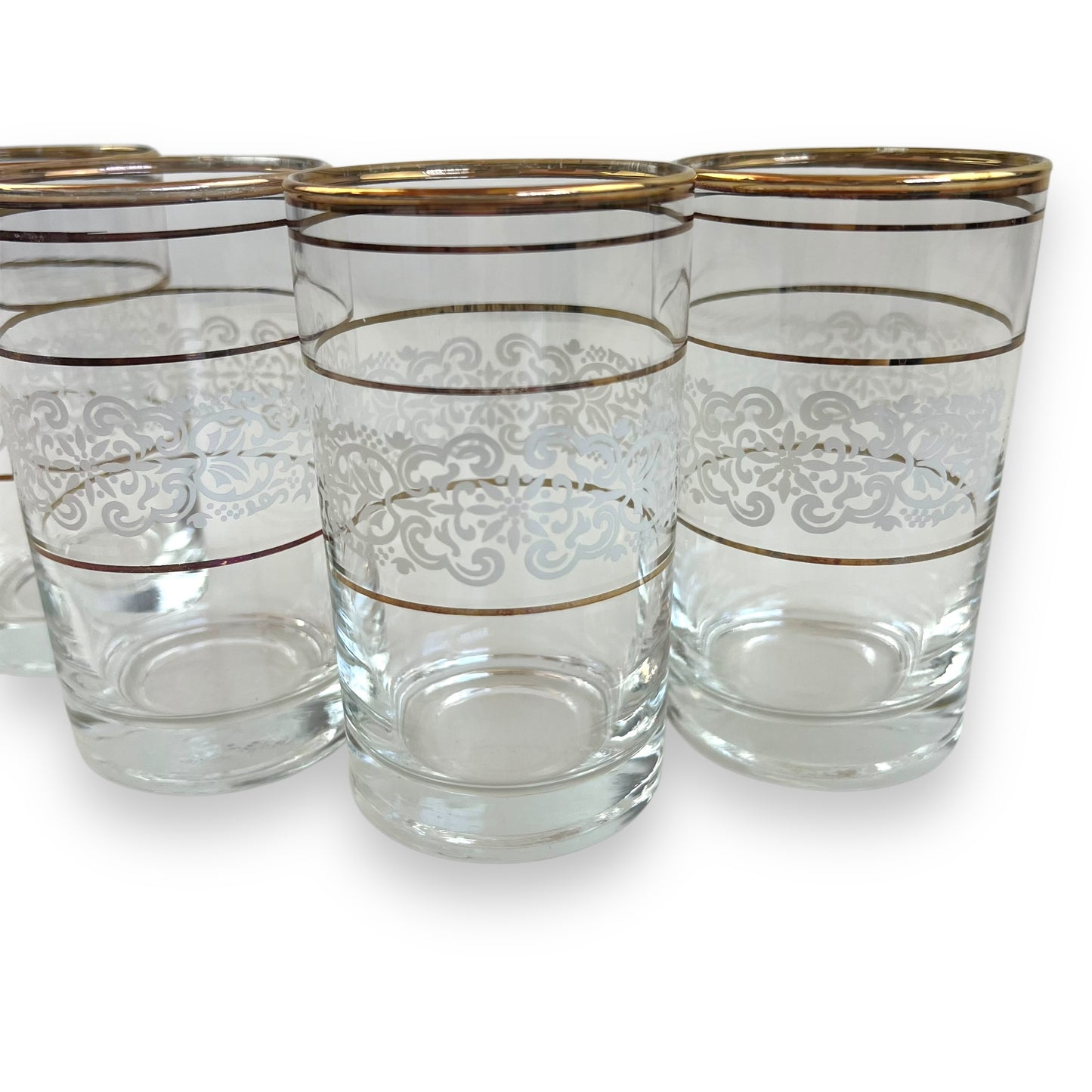 White ornate pattern with gold band glass set of 4