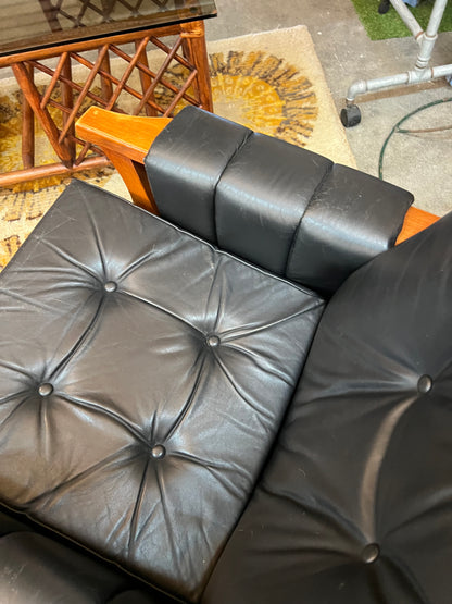 2. Mid-Century Black Leather Swivel Lounge Chair