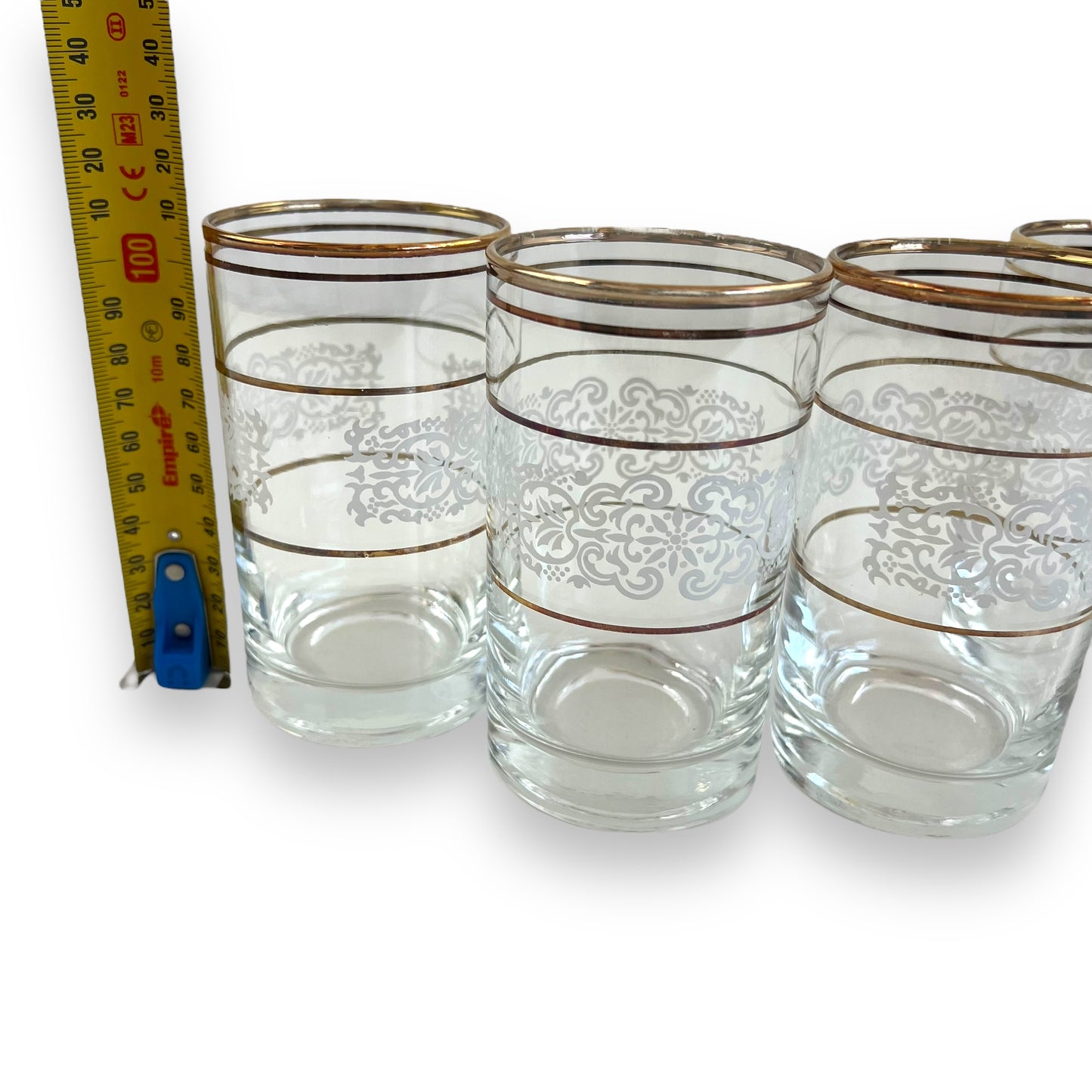 White ornate pattern with gold band glass set of 4