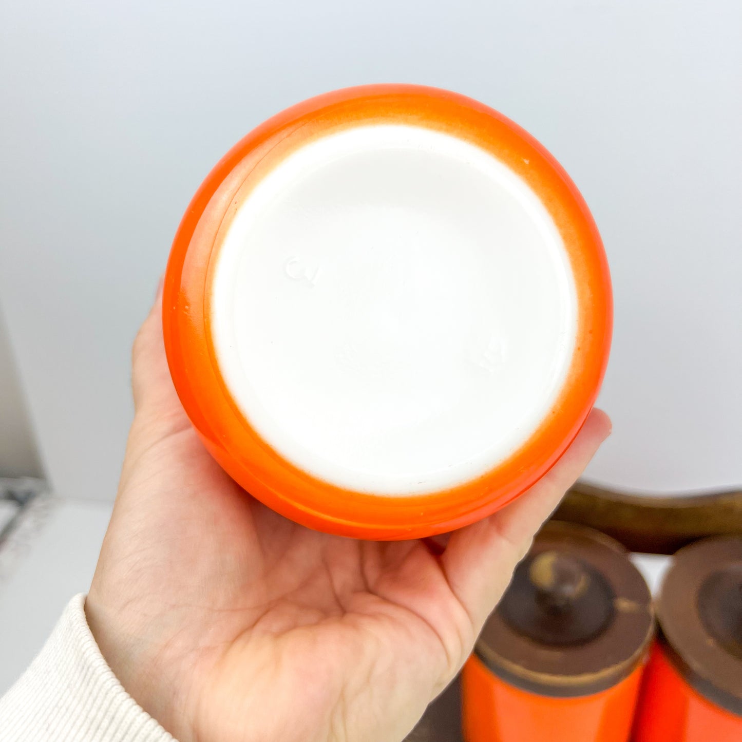 Orange Kitchen Storage Canister Jars with wooden lids and wooden hanging shelf