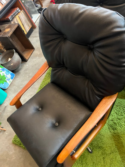 1. Black Vinyl Swivel Armchair with Timber Arms