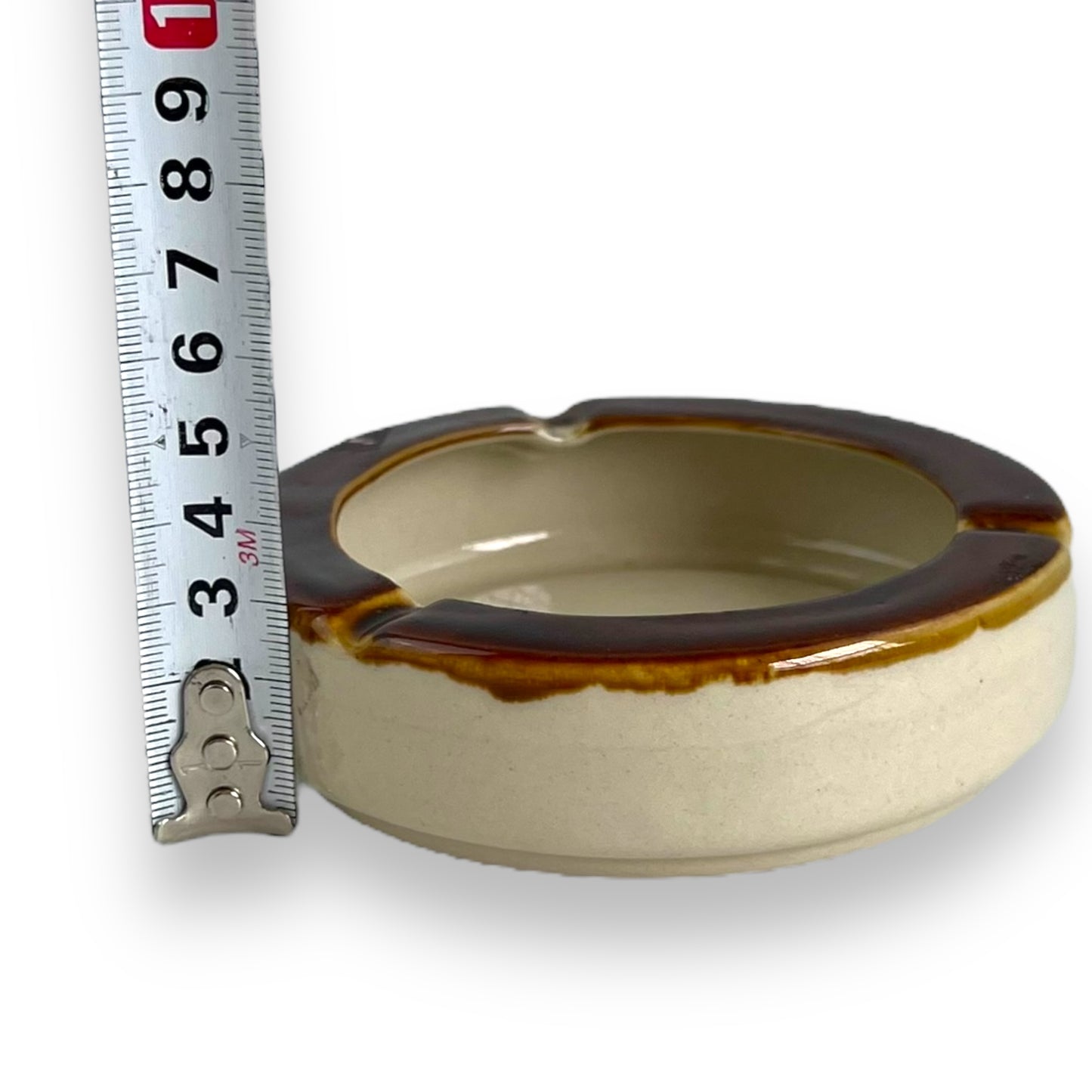 Brown and beige ceramic round ashtray