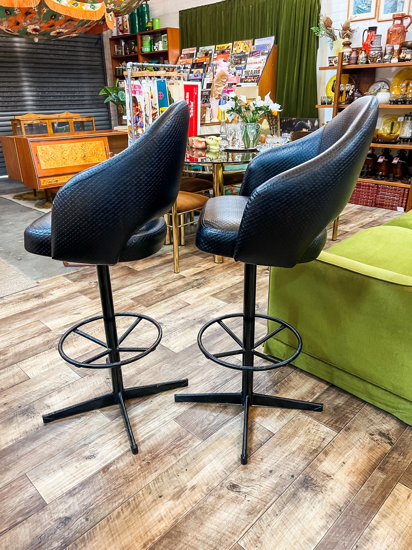 Pair of Black Vinyl Bar Stools with Footrest Base