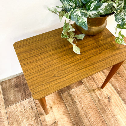 Small brown laminate side table