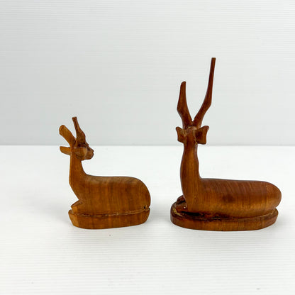 Carved Wooden Laying Antelope Statue Pair