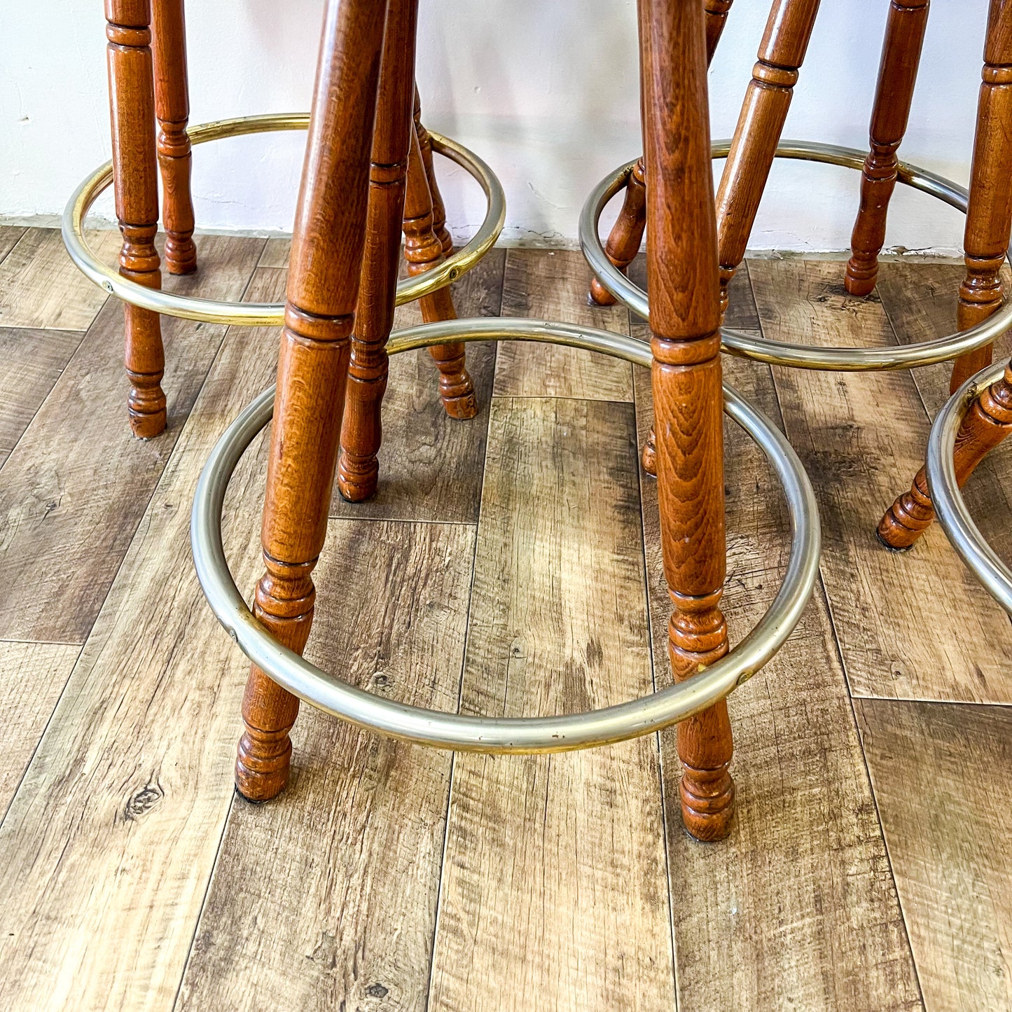Brown Captains Mate timber swivel barstool with metal ring footrest