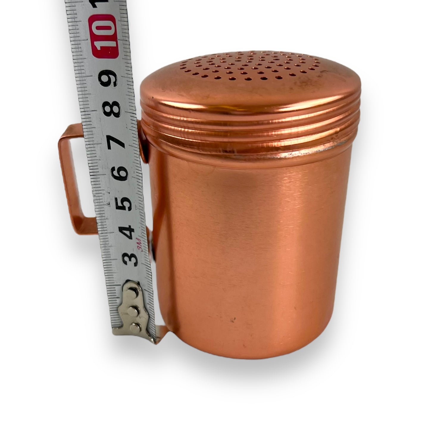 Rose gold coloured metal condiment shaker