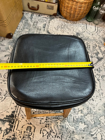 Wooden stool with black top