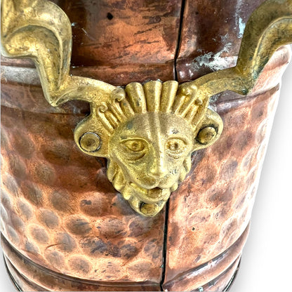 Brass and copper lion head plant pot