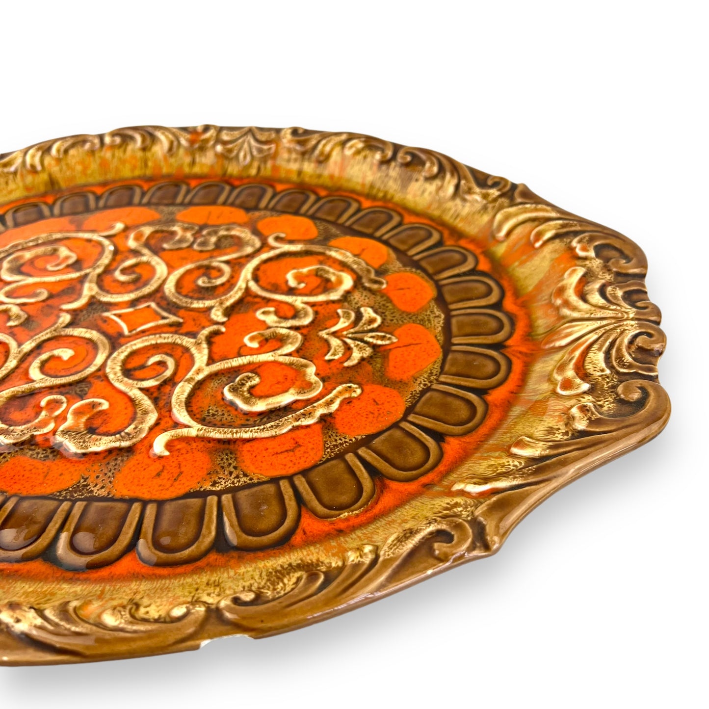 Large orange and brown ornate ceramic serving platter