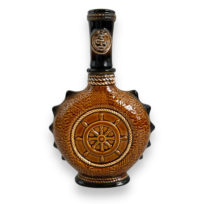 Brown Ceramic Decanter with Ship and wheel design.