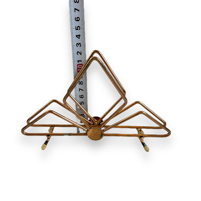 Copper coloured triangle design letter / napkin holder