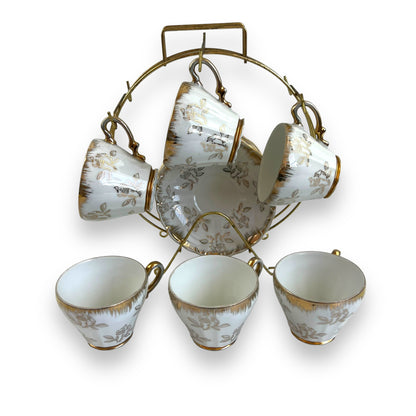 Vintage Japan Tea Cup and Saucer Set with Gold Accents and Floral Design on Brass Rack - 11 piece set