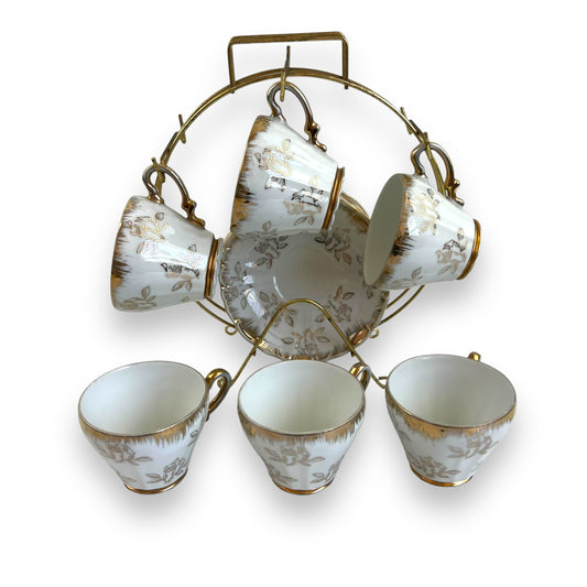 Vintage Japan Tea Cup and Saucer Set with Gold Accents and Floral Design on Brass Rack - 11 piece set