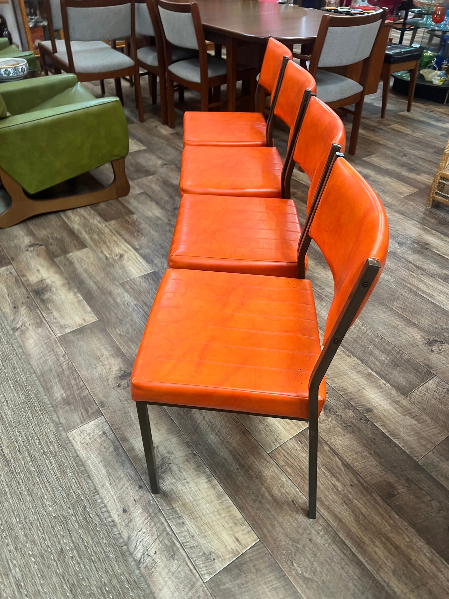 Set of 4 Mid Century Bright Orange Vinyl Dining Chairs with Dark Brown Steel Frames