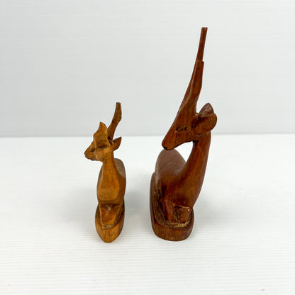 Carved Wooden Laying Antelope Statue Pair