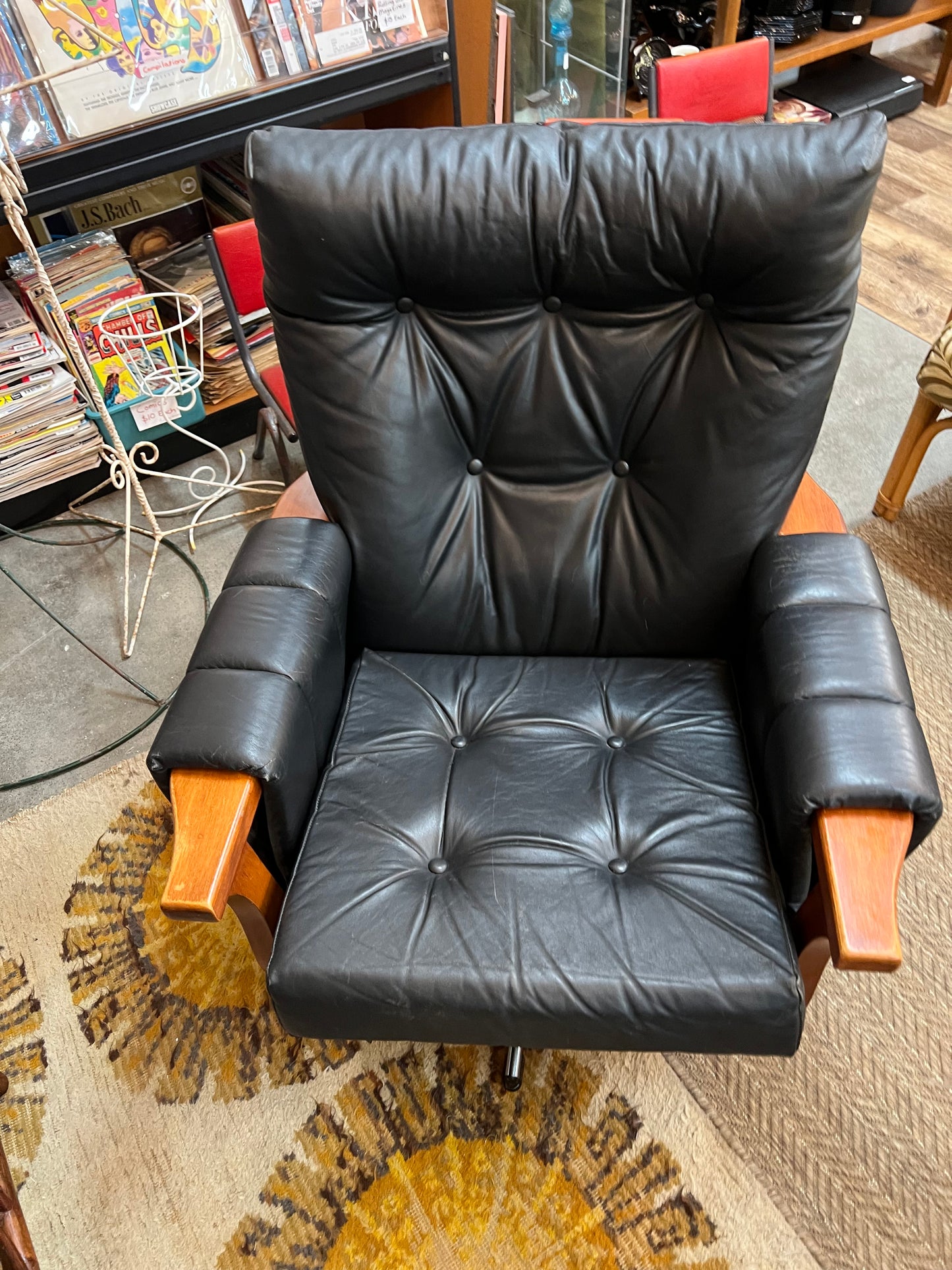 2. Mid-Century Black Leather Swivel Lounge Chair