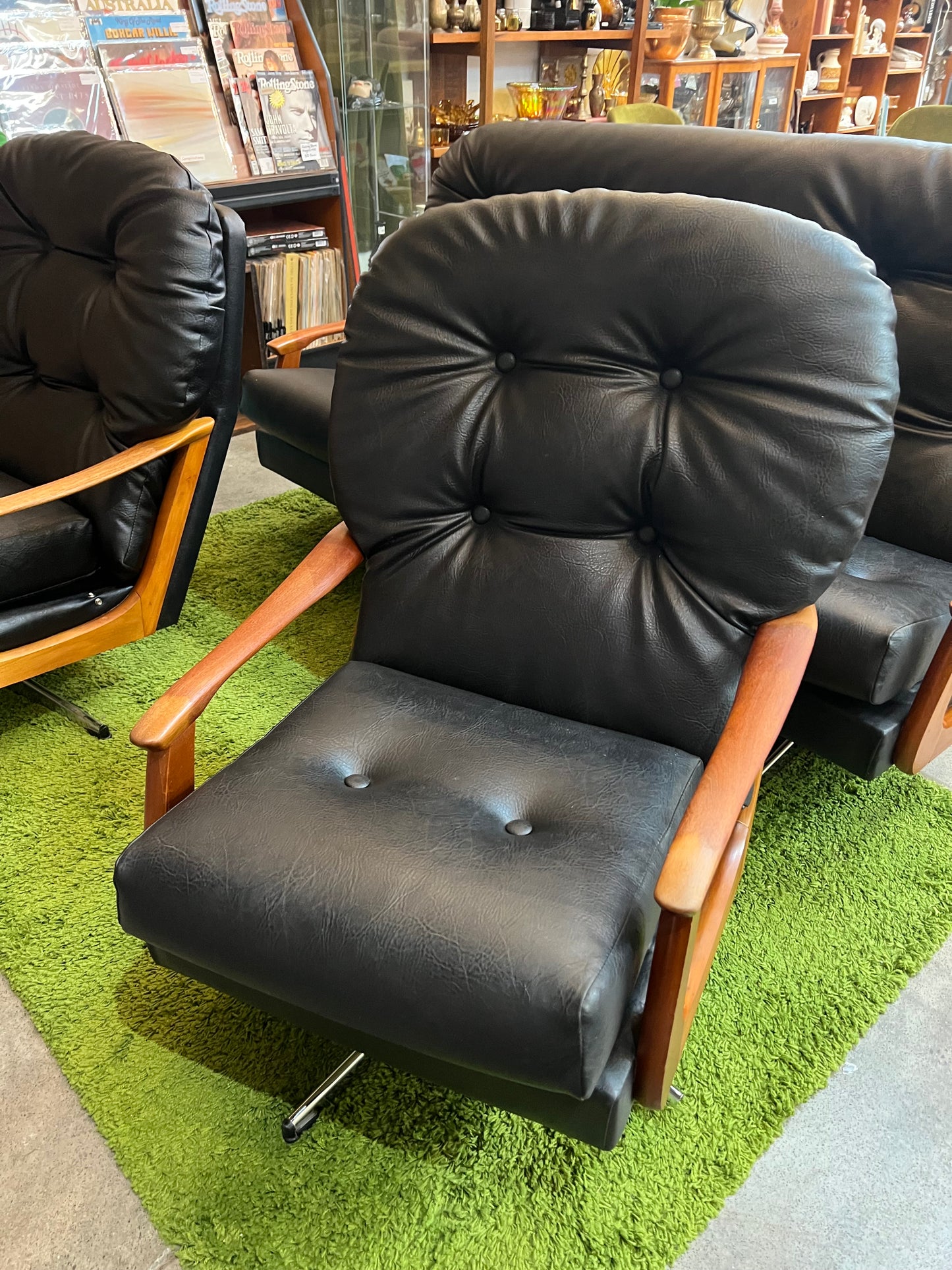 2. Black Vinyl Swivel Armchair with Timber Arms