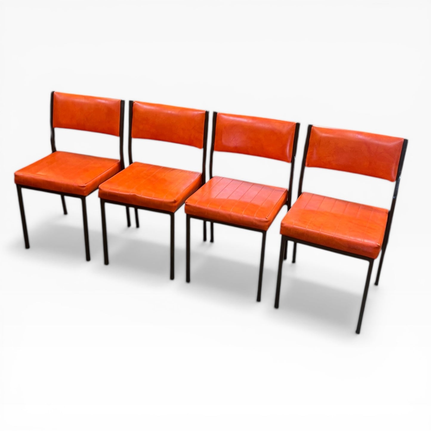 Set of 4 Mid Century Bright Orange Vinyl Dining Chairs with Dark Brown Steel Frames