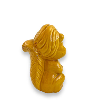 Retro yellow squirrel statue