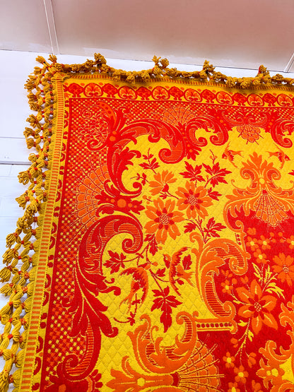 Large orange and yellow patterned wool rug