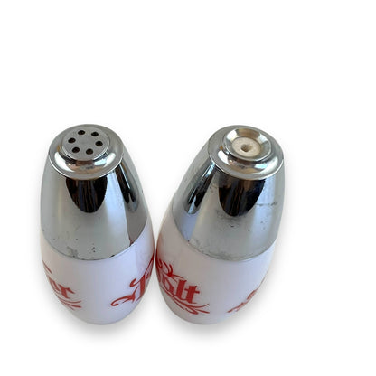White with red writing and chrome top salt and pepper shaker set