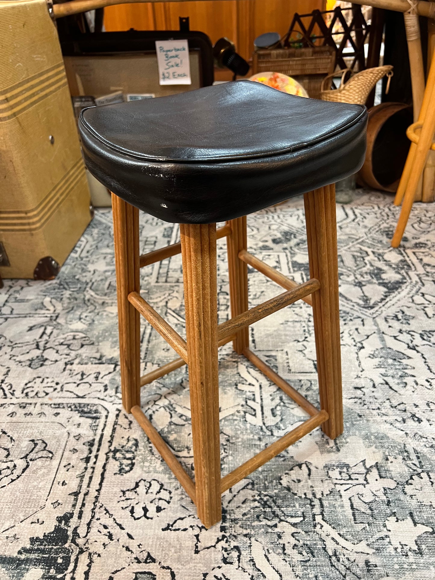 Wooden stool with black top