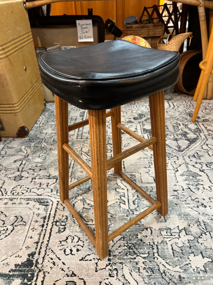 Wooden stool with black top