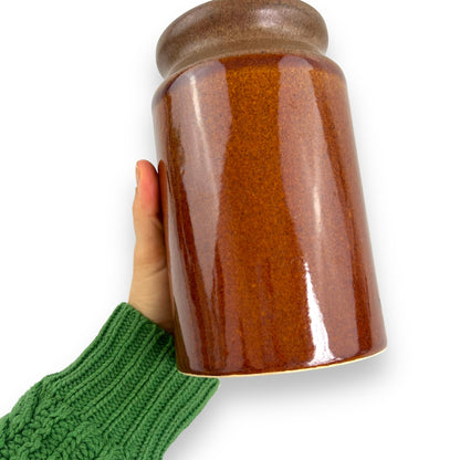 Brown pottery jar with cork lid