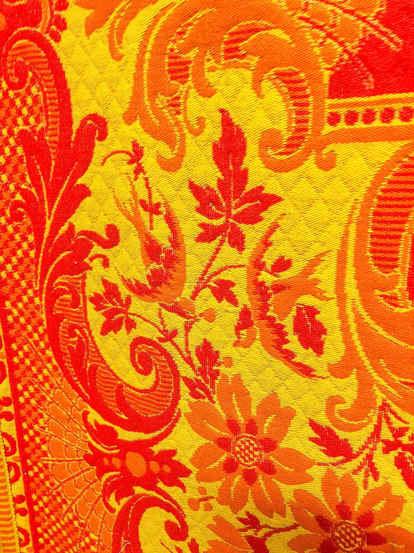 Large orange and yellow patterned wool rug