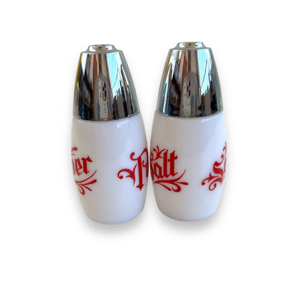 White with red writing and chrome top salt and pepper shaker set