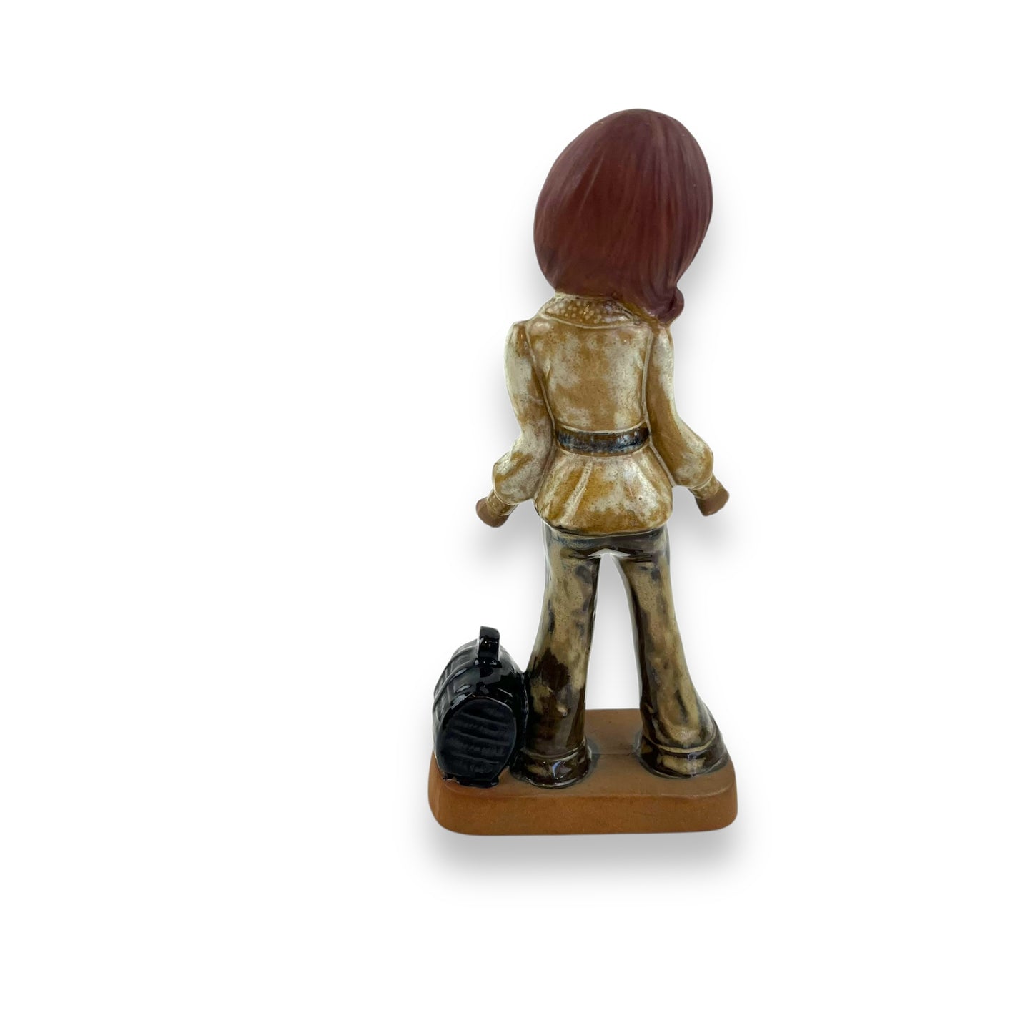 Girl with eyes closed statue and bag