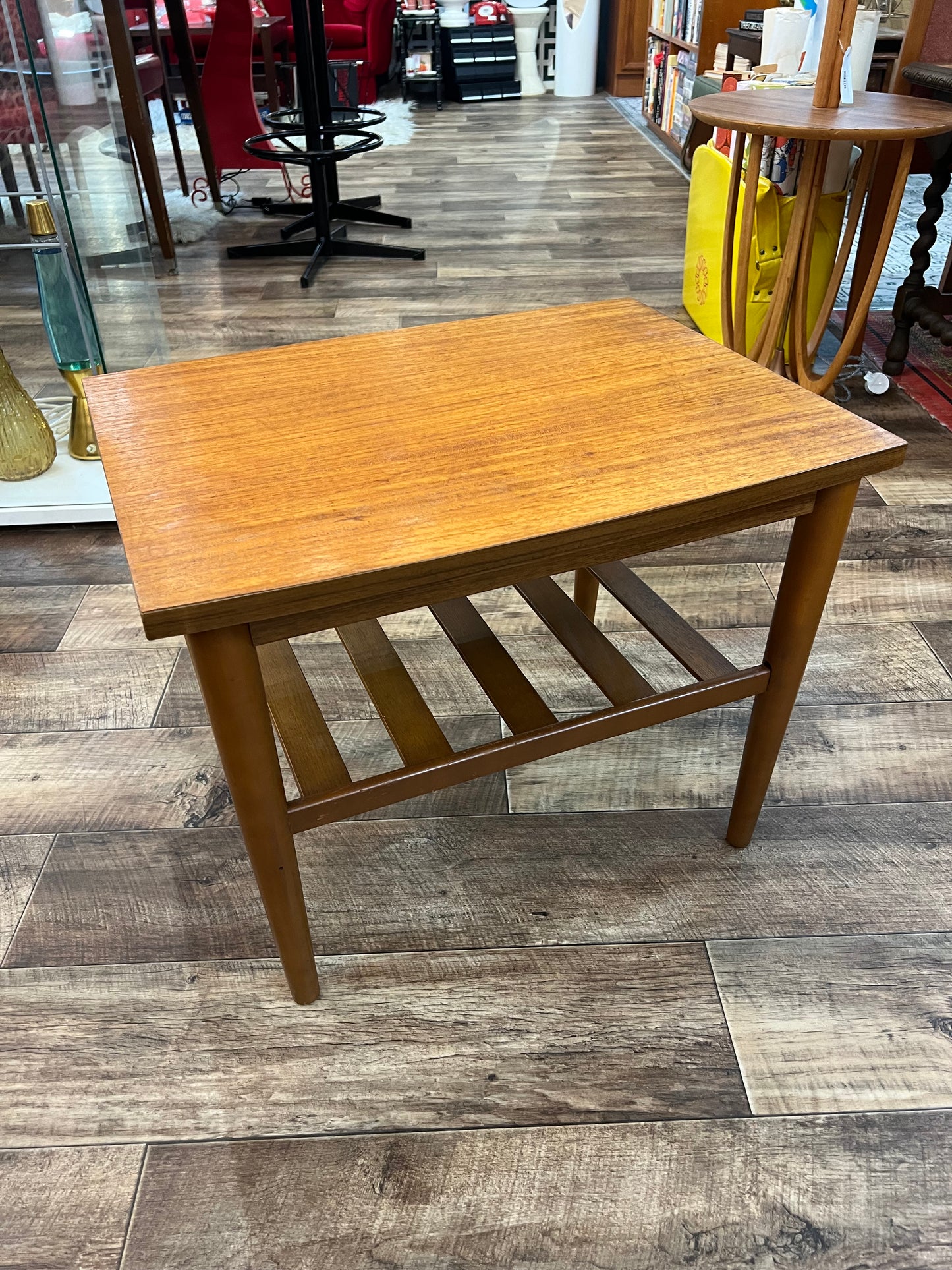 Mid century Teak side table with slated magazine shelf