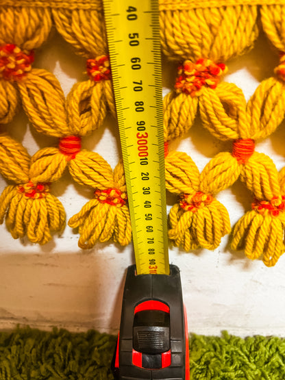 Large orange and yellow patterned wool rug