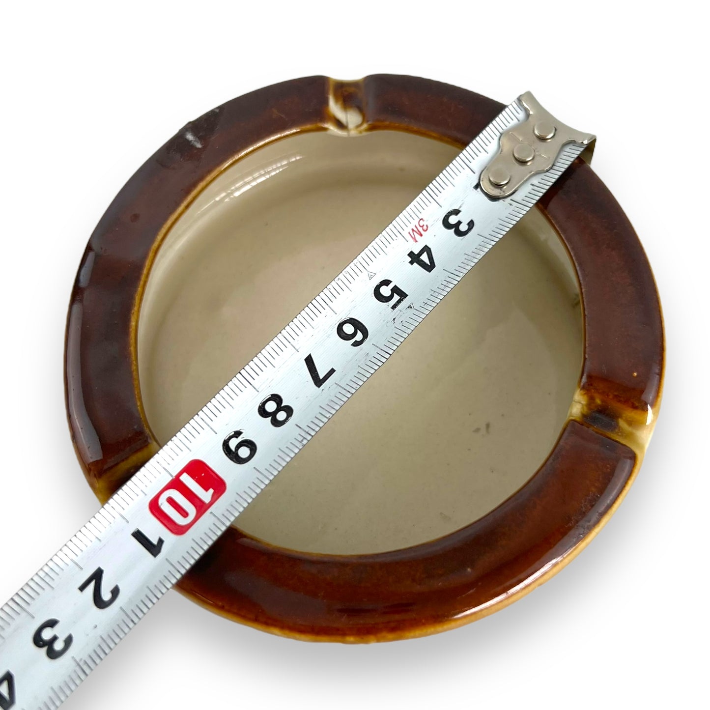 Brown and beige ceramic round ashtray