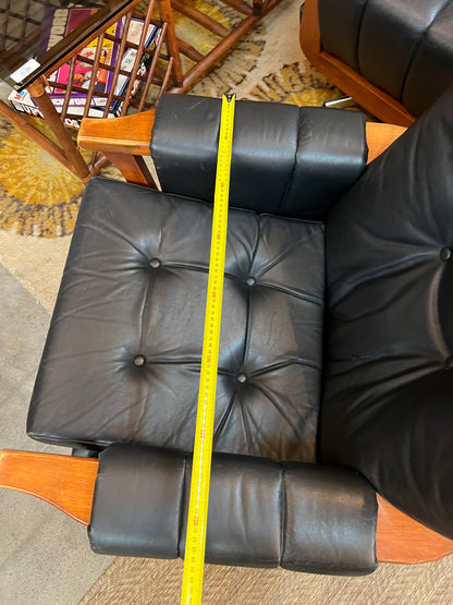1. Mid-Century Black Leather Swivel Lounge Chair
