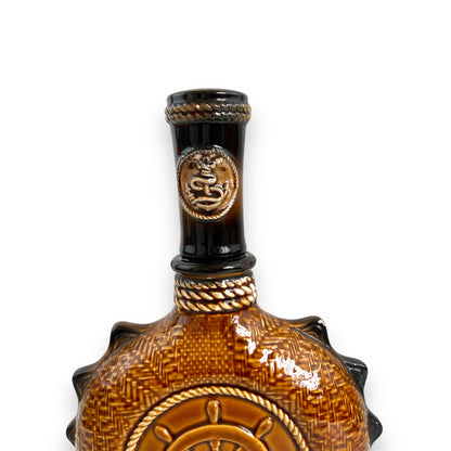 Brown Ceramic Decanter with Ship and wheel design.