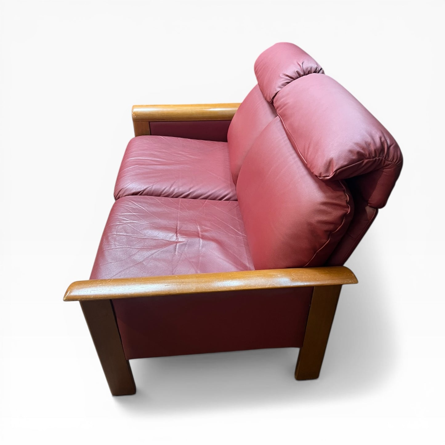 Two Seater Lounge with Sculpted Curved Timber Armrests & Burgundy Leather Cushions