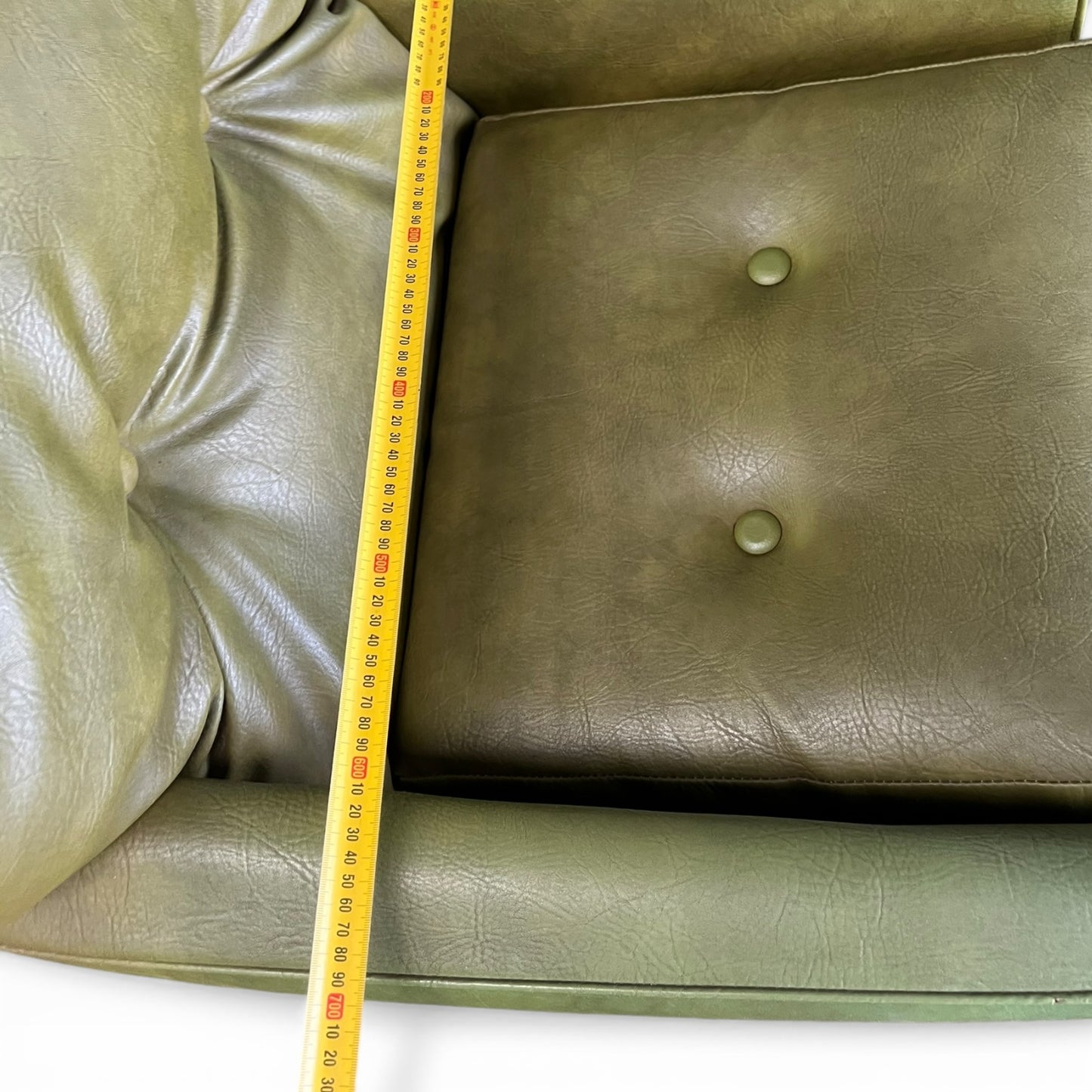 Olive Green Vinyl Lounge Armchair with Timber Sleigh Base
 (rip on side)