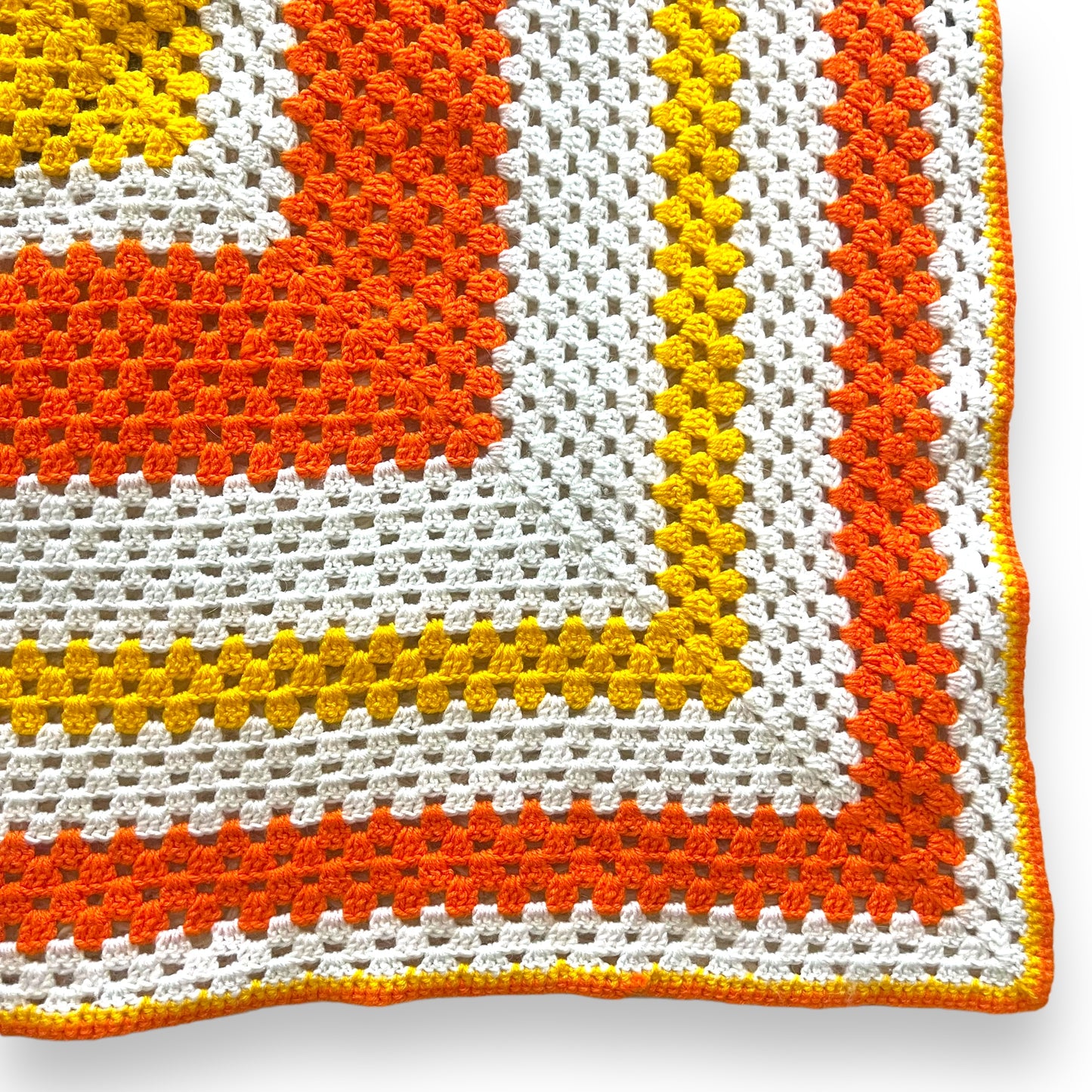 Orange, yellow and white crochet knit blanket