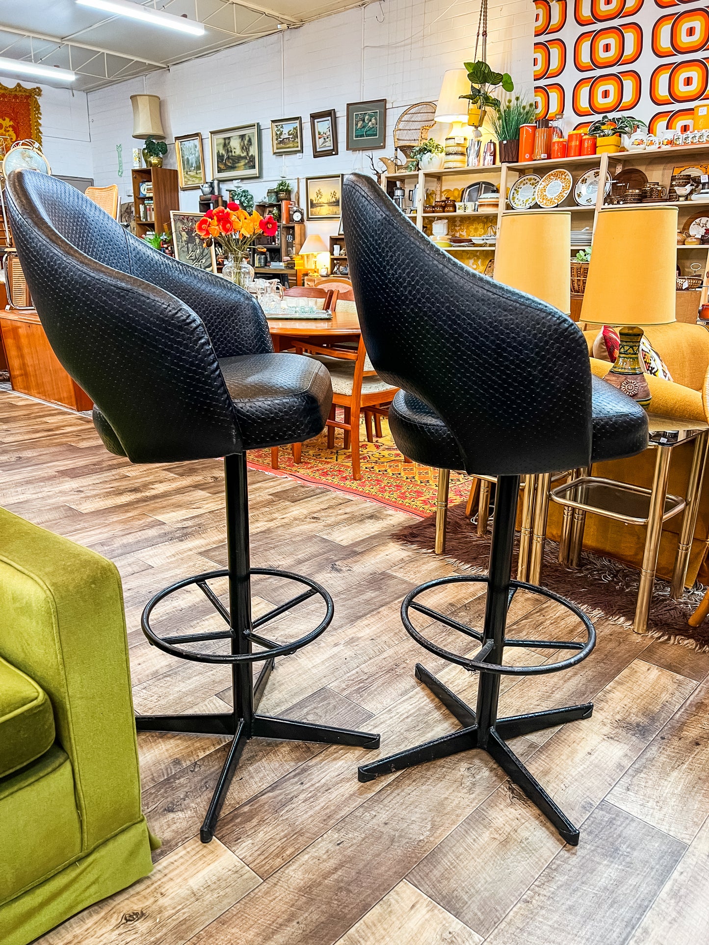 Pair of Black Vinyl Bar Stools with Footrest Base